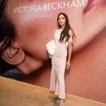 victoria-beckham-relaxes-by-the-pool-while-donning-an-extreme-plunging-gown
