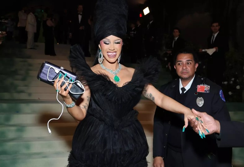 Previously, Cardi B was caught on Vogue's live feed of the event, and her phone was visible too. Image Credits: Getty