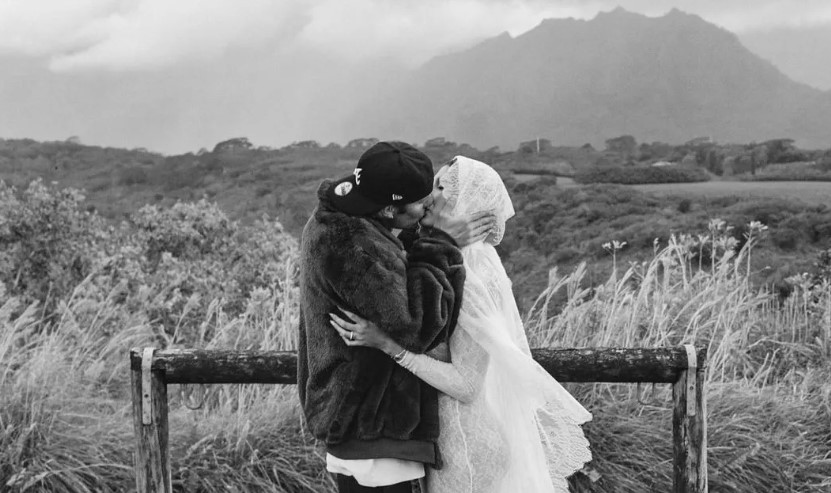 The couple shares romantic photos on Instagram, showcasing Hailey's baby bump in a white lace dress. Image Credits: Instagram