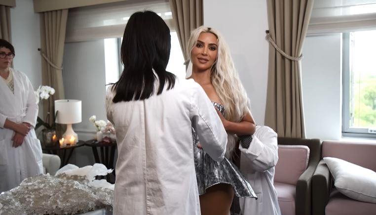 Kim had to go through multiple steps to wear the tightly fitted dress, including wearing the corset for over 30 minutes. Image Credits: Vogue