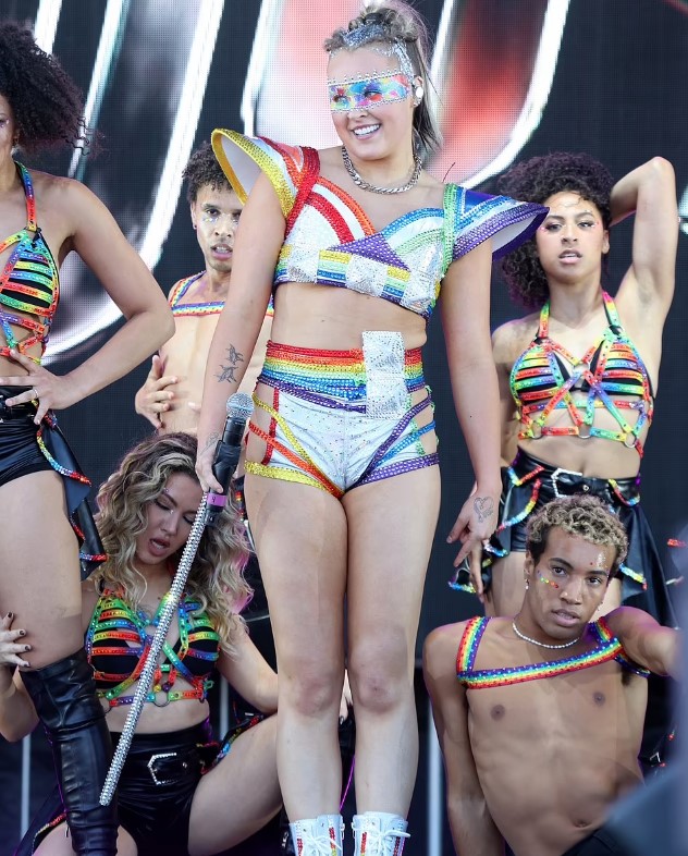 The 21-year-old pop star JoJo Siwa dances provocatively with scantily clad backup dancers at the Pride event. Image Credit: Getty