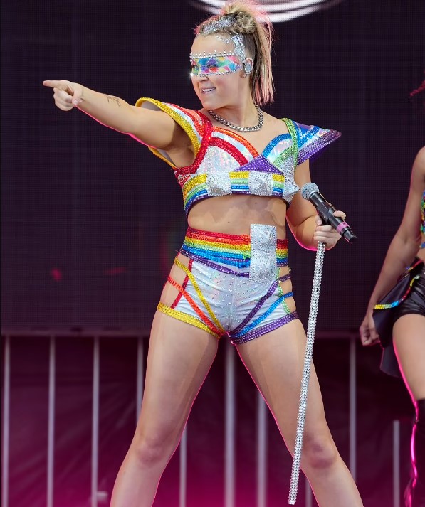 JoJo Siwa, a 21-year-old pop star, was seen drinking Tito's vodka during a Pride event performance. Image Credit: Getty