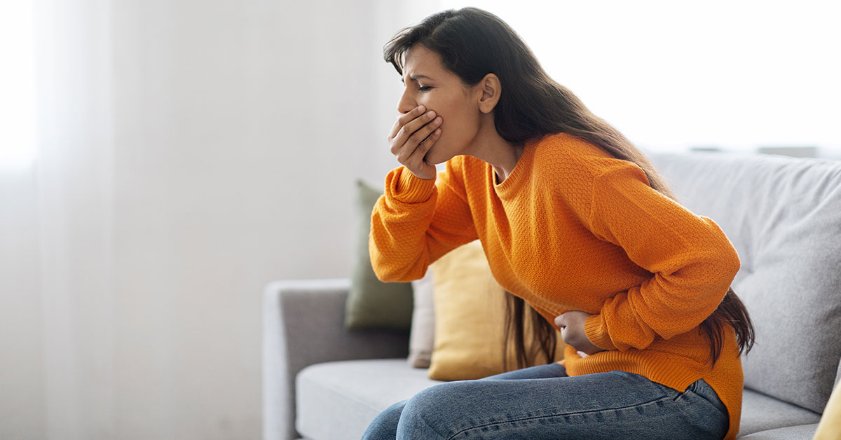 woman displaying symptoms of nausea