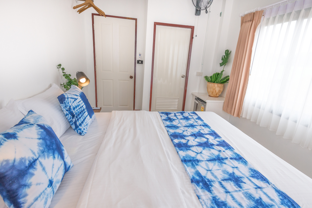 A bed room with blue and white style . Look amazing for take a nap or sleeping here with a lover for honeymoon period.
